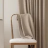 Milk Tea Cloud Curtain – milk tea beige soft-texture curtain draped on chair, light-filtering privacy fabric