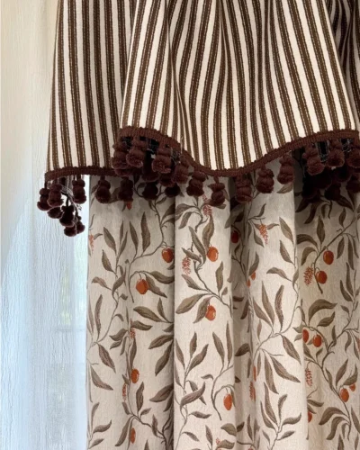 Autumn Berry Jacquard blackout curtain header detail – striped valance with tassel trim and botanical drape