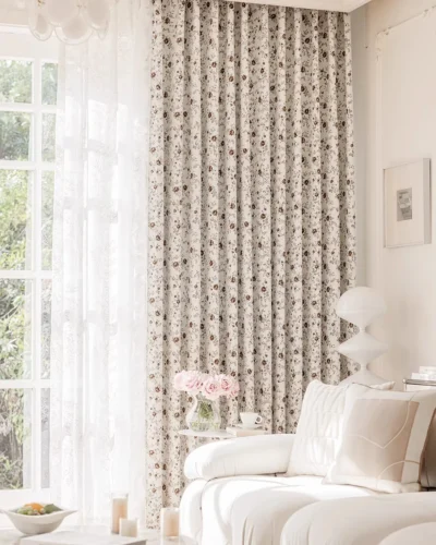 Ivory floral jacquard curtain in Cocoa Bloom in a bright living room, layered with white sheers