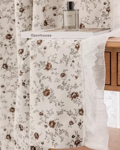 Ivory floral jacquard curtain in Cocoa Bloom layered with white sheer, vintage floral corner styling