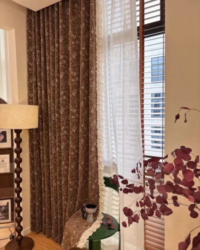 brown floral jacquard curtain in mocha brown, vintage floral drape styled in a cosy bedroom with warm light