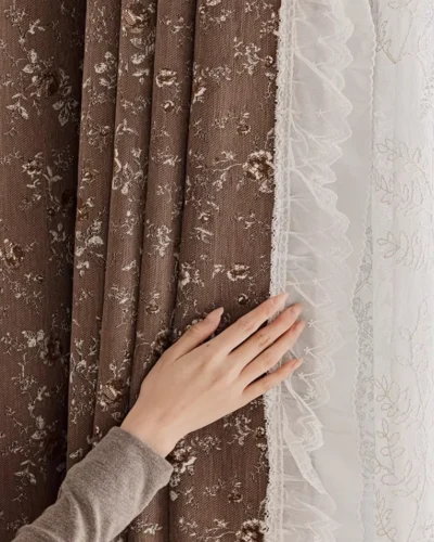 brown floral jacquard curtain in mocha brown beside white lace sheer, hand-touch texture detail