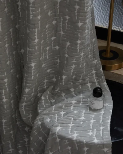 Ash Vein sheer curtain in a modern room, abstract textured voile with soft light filtering