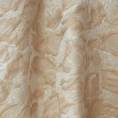 Soft Mist Jacquard Curtain draped over a chair, abstract cloud texture jacquard, semi-sheer light filtering