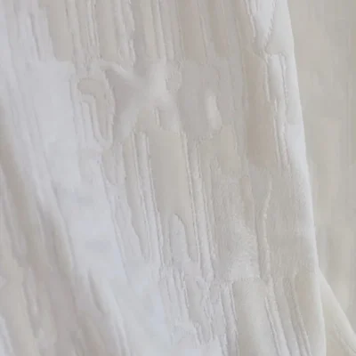 Cloudwash Jacquard Curtain close-up, subtle relief texture with soft light filtering