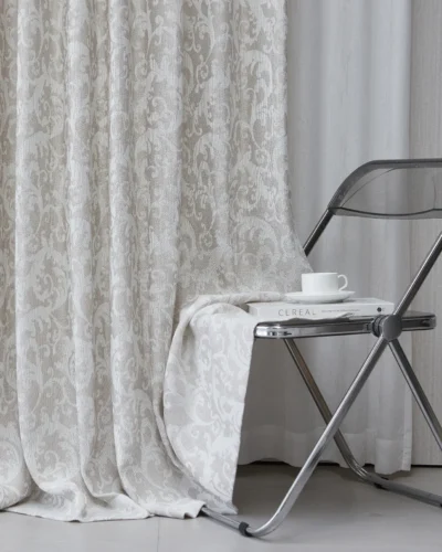 Mist Garden grey damask curtain in a modern room, soft light-filtering texture, S-curve wave fold