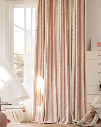Whisper Stripe Curtain in blush pink, textured stripe drapes in a bright bedroom by the window