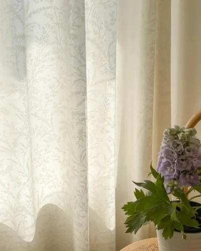 Ivory Botanica Jacquard Curtain softly filtering sunlight by a window with subtle floral vine texture