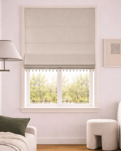 Light greige Roman shade on a bright window, soft light-filtering look