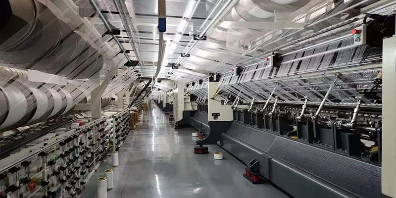 Custom curtain manufacturing workshop interior with textile production equipment