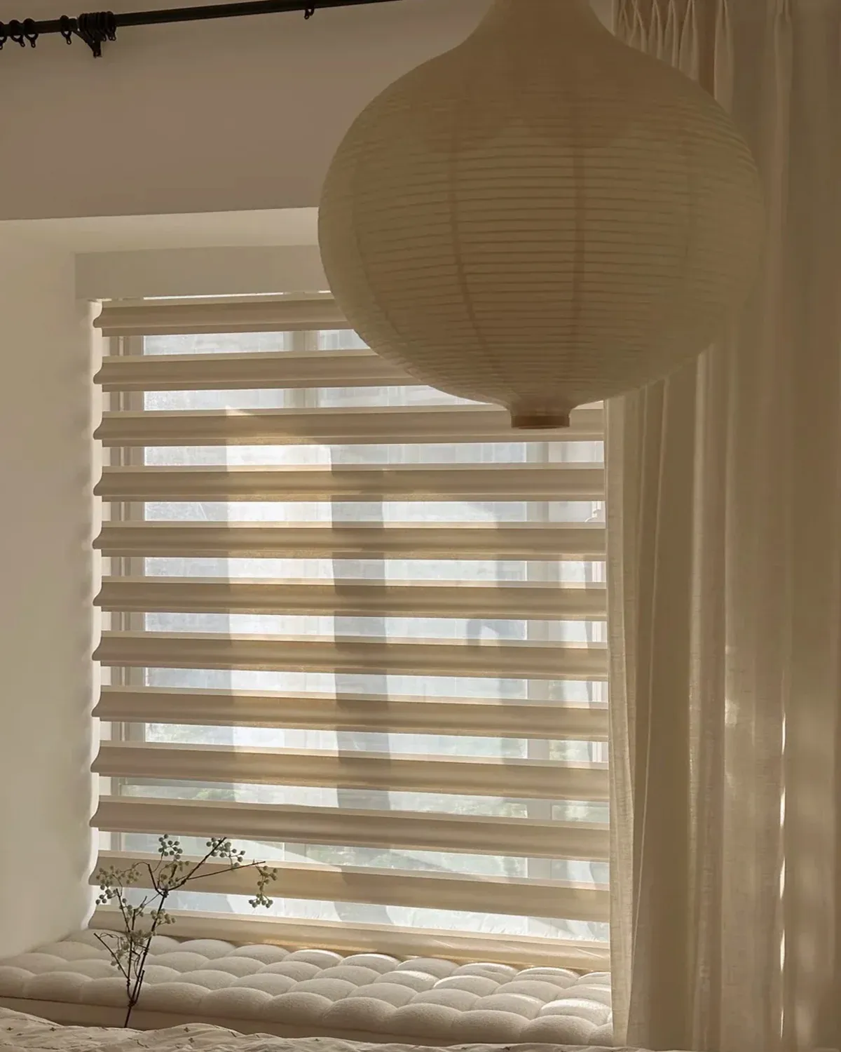 Semi-blackout waterproof Floating Vane Shangri-La Blind in a soft neutral room