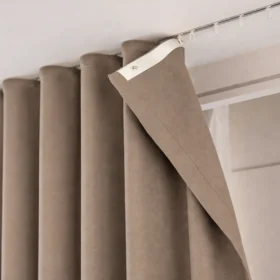 Taupe S-curve wave curtain close-up with smooth drape and easy hanging track detail