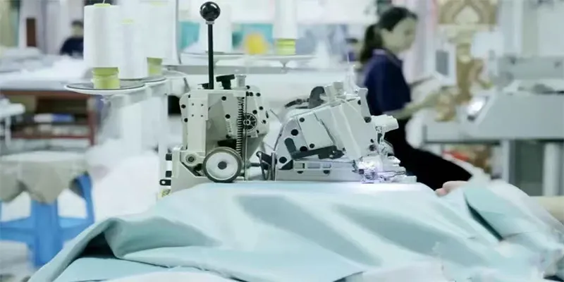 Custom curtain factory workers processing made-to-measure curtain fabric