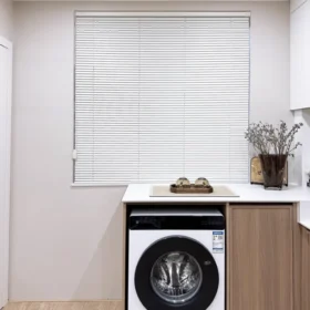 Custom venetian blinds in a modern living room with soft natural light
