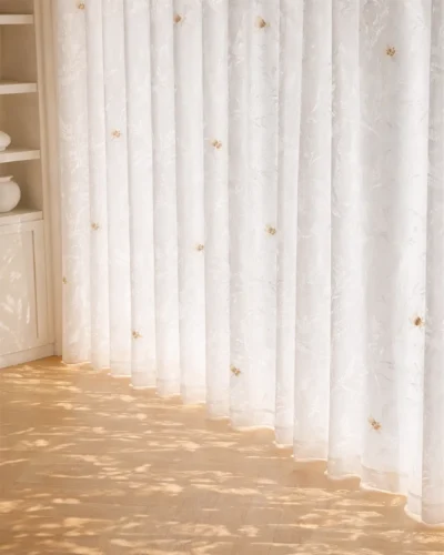 Amber Dragonfly Sheer Curtain in soft white fabric with light-filtering S-curve folds and embroidered dragonfly details