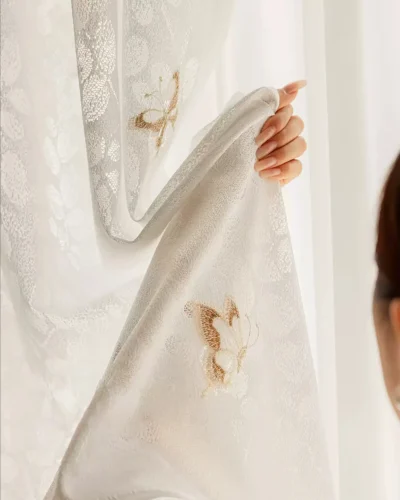 Close-up of Butterfly Veil Sheer Curtain with floral texture and butterfly embroidery