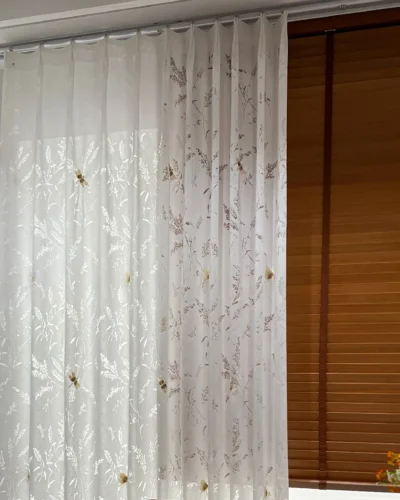 Amber Dragonfly Sheer Curtain in white botanical embroidered fabric with S-curve drape