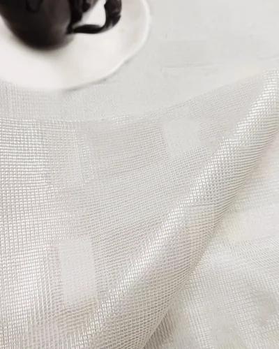 Close-up of Ivory Grid Sheer Curtain fabric showing soft woven texture and subtle geometric pattern