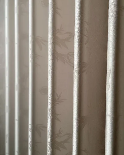 Close-up view of Taupe Bamboo Shadow Curtain with subtle bamboo pattern and soft texture