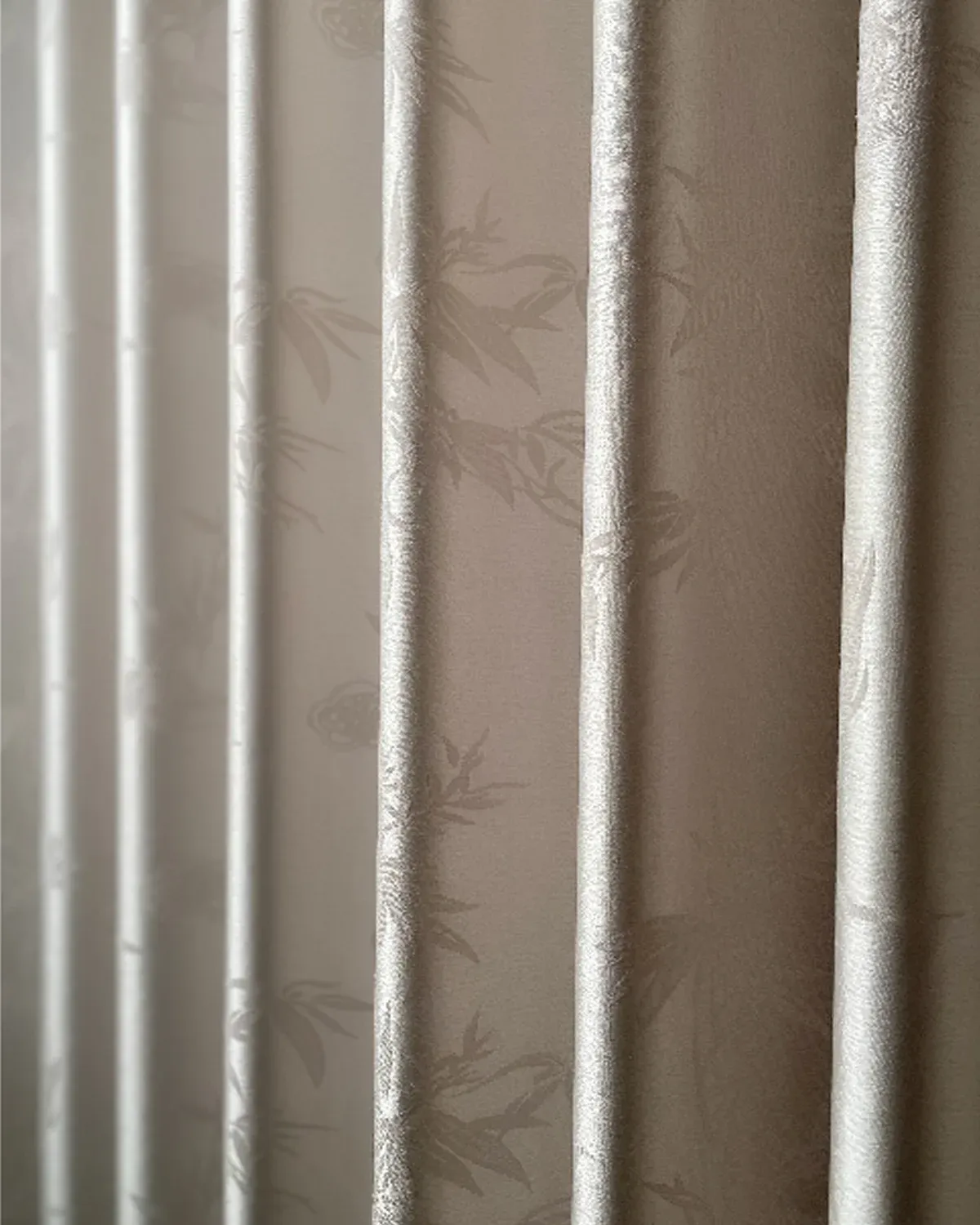 Close-up view of Taupe Bamboo Shadow Curtain with subtle bamboo pattern and soft texture