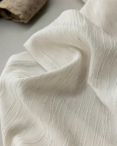 Close-up detail of Oat Ripple Sheer Curtain fabric with soft vertical ripple texture