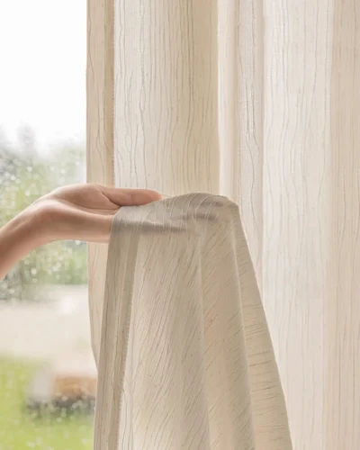 Close-up of Oat Ripple Sheer Curtain showing its soft airy feel and subtle vertical ripple texture