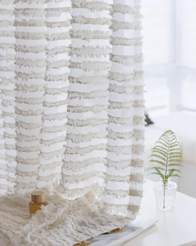 Close-up of Frosted Feather Sheer Curtain fabric showing airy texture and delicate feather-inspired detail