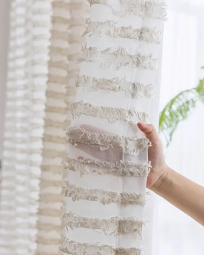 Close-up of Frosted Feather Sheer Curtain fabric showing airy texture and delicate feather-inspired detail