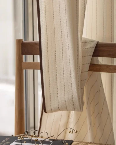 Close-up of Mocha Pinstripe Sheer Curtain fabric showing soft texture and subtle vertical stripe detail