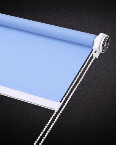 Light blue blackout roller blind with smooth fabric and white chain control