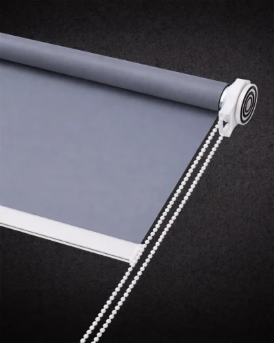 Smoke grey blackout roller blind with smooth fabric and white chain control