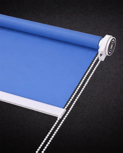 Blue blackout roller blind with smooth fabric and white chain control