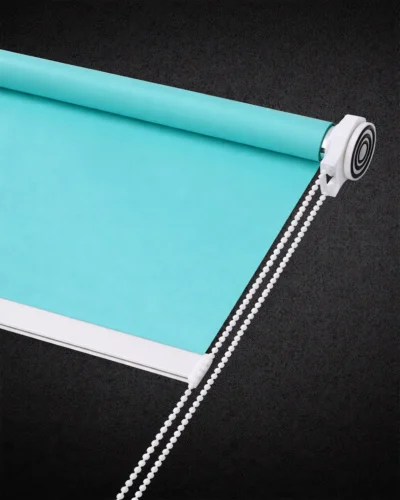 Light green blackout roller blind with smooth fabric and white chain control