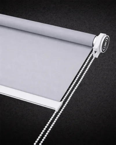 Light grey blackout roller blind with smooth fabric and white chain control