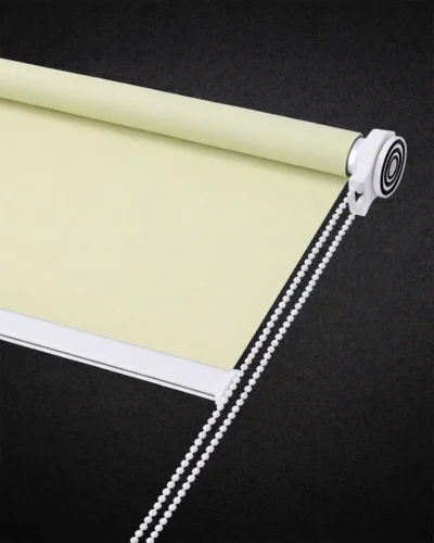 Light green blackout roller blind with smooth fabric and white chain control