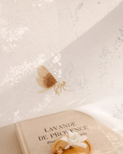 Amber Dragonfly Sheer Curtain close-up with embroidered dragonfly details and soft white textured fabric