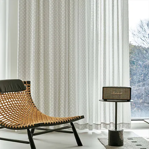 Light sheer curtains in a bright interior with soft natural daylight