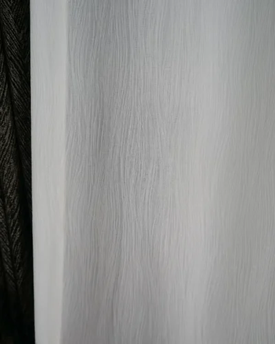 soft white linen texture sheer curtain fabric close-up with natural vertical weave