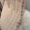 Beautiful Cotton Candy Cloud Blackout Curtain in soft pink textured fabric with raised cloud pattern and decorative tassel trim.
